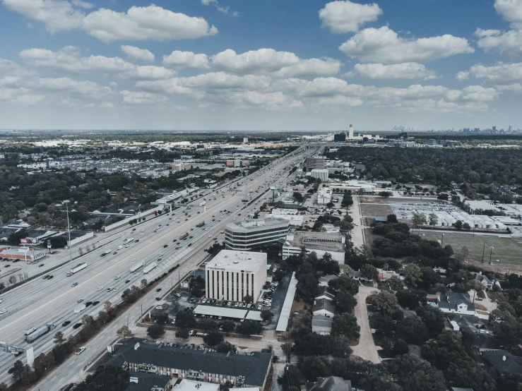 an aerial view of a city skyline and roads