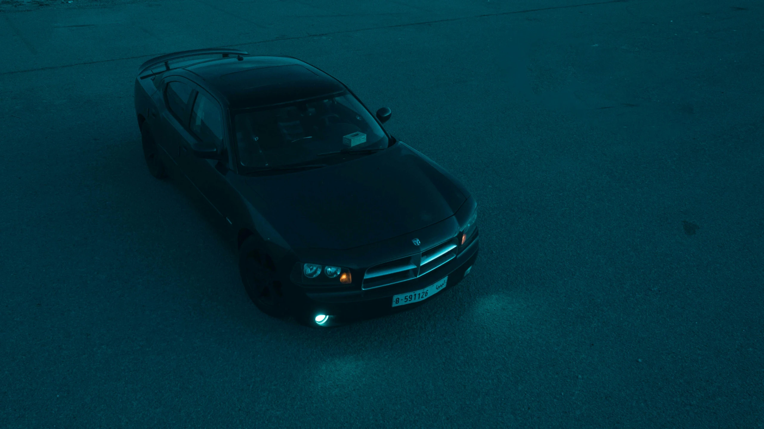 an suv parked in a parking lot at night