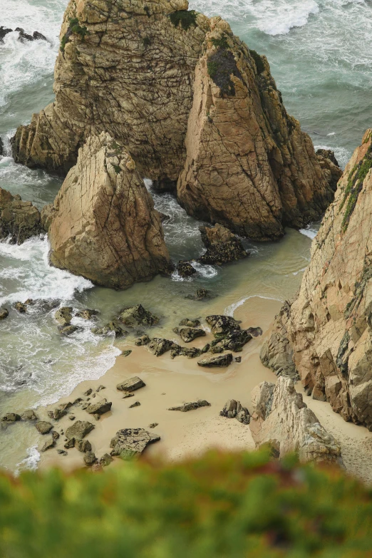 a rocky beach with several rocks near by