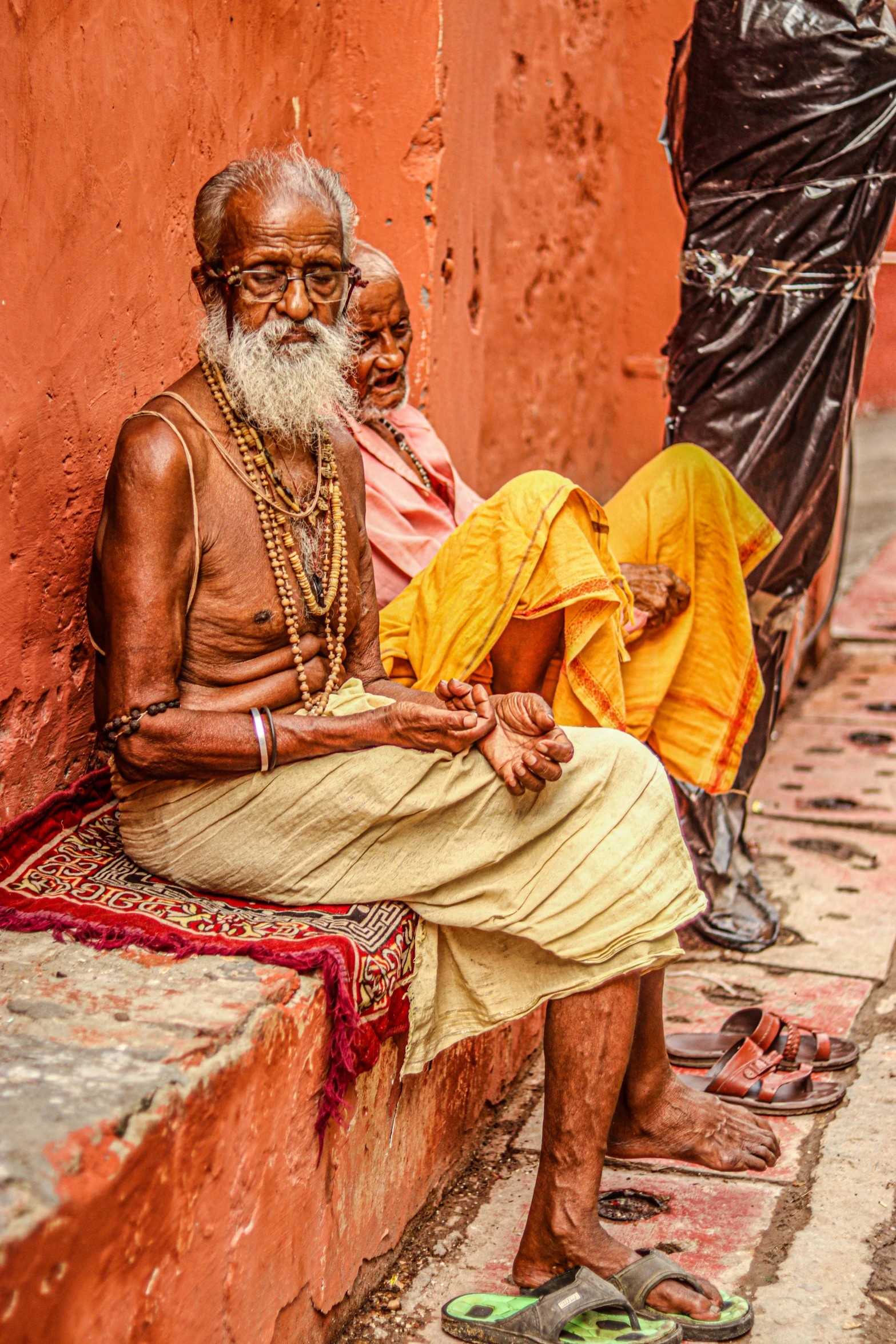 a man and woman sit on some steps