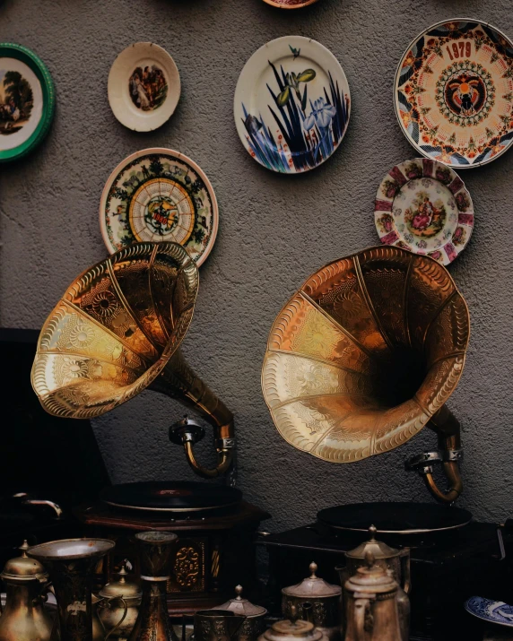 a wall covered in old records and musical instruments