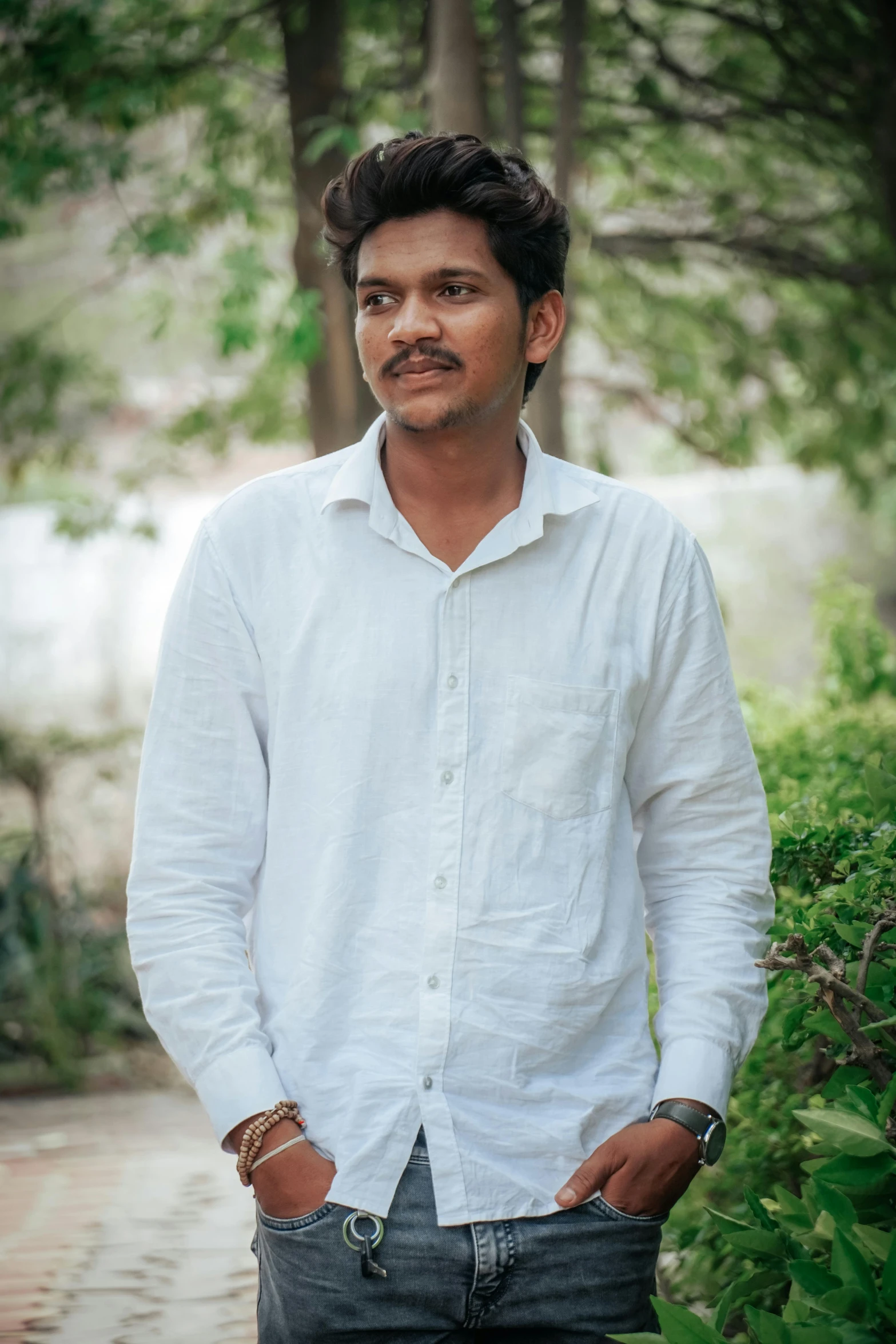 a man standing with his hands in his pockets