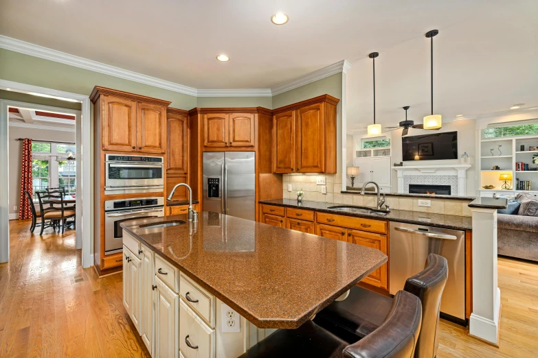 a kitchen has wooden cabinets and a stove