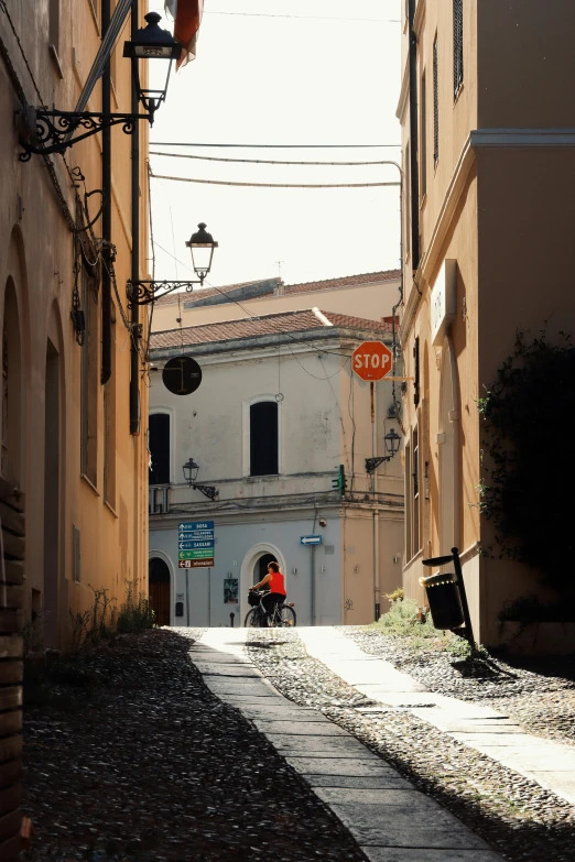 people walking down an alleyway on either side