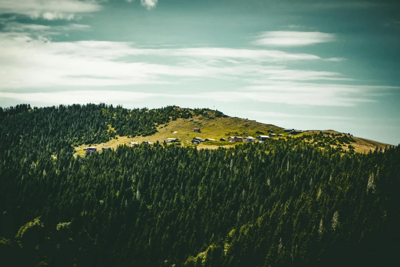 a small village is seen on top of a hill