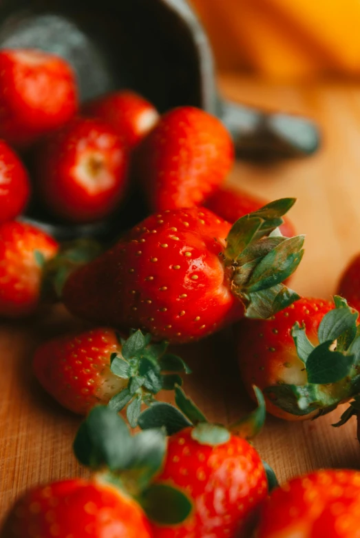 a group of ripe strawberries with leaves