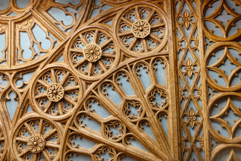 an intricate wood carving work on the side of a wall