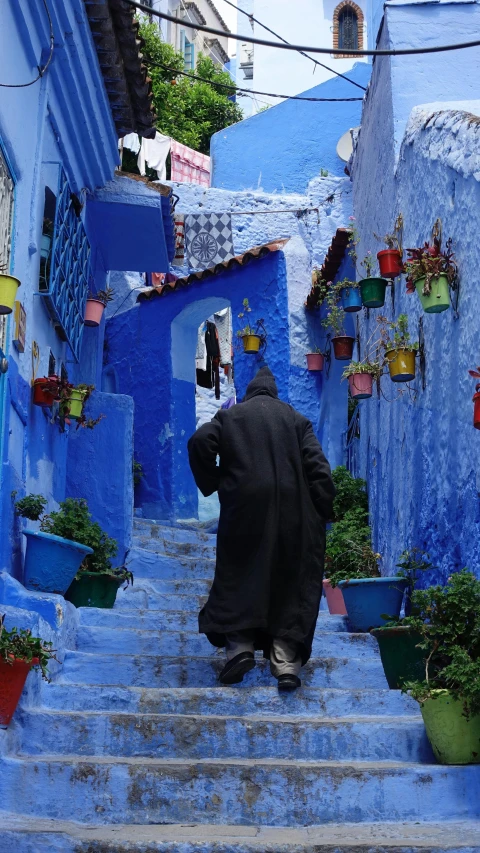 a person in a nun suit climbing up a set of steps