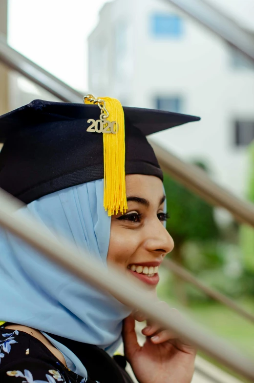 a young woman in graduation cap and gown