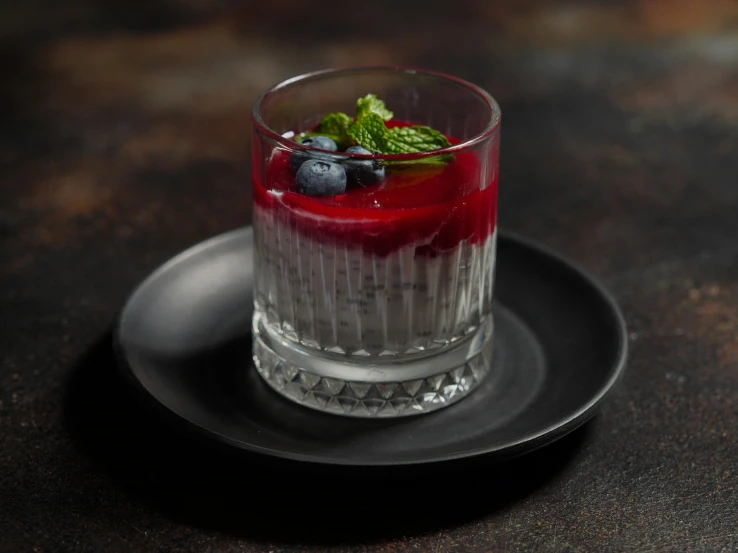 fruit - topped mojit with mint on a plate