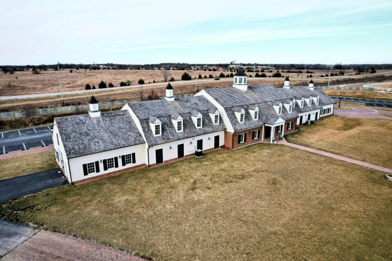 an aerial view of a very big building in the country side