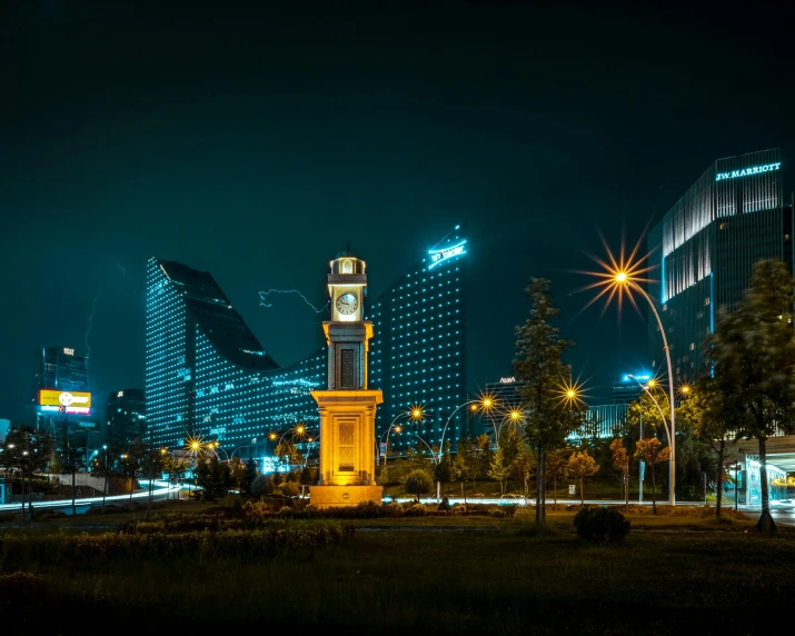 a tall building with a clock tower next to it