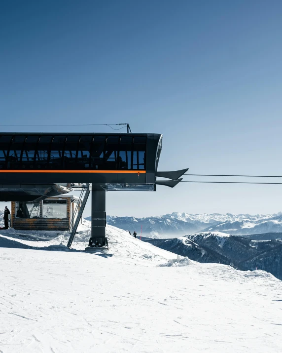 a bus that is sitting on a snowy hill