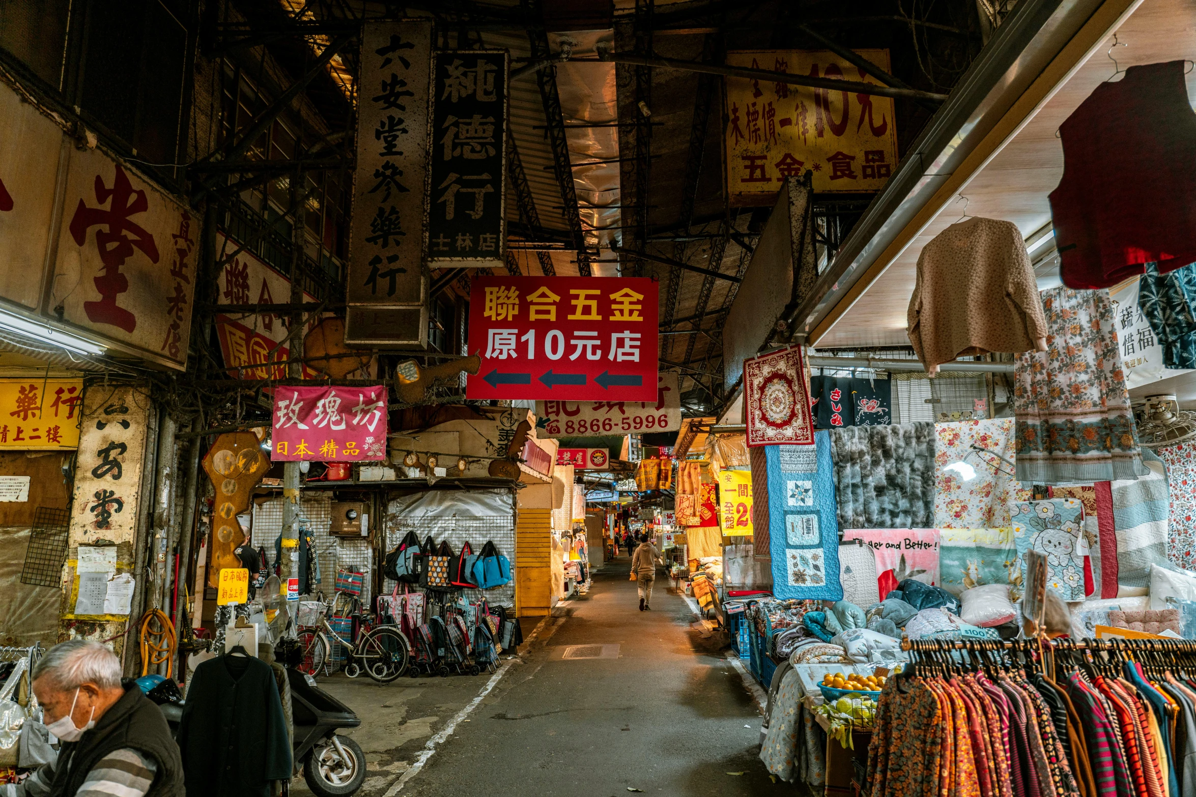 an alley that is open and has many different colored signs in the middle