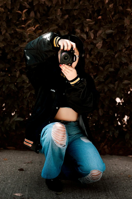 a woman is kneeling down and taking a po