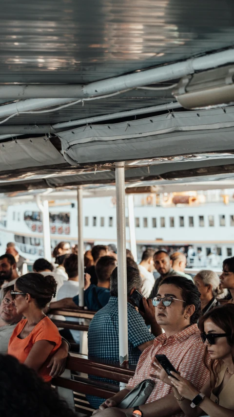 a couple of people sitting on some chairs on a boat