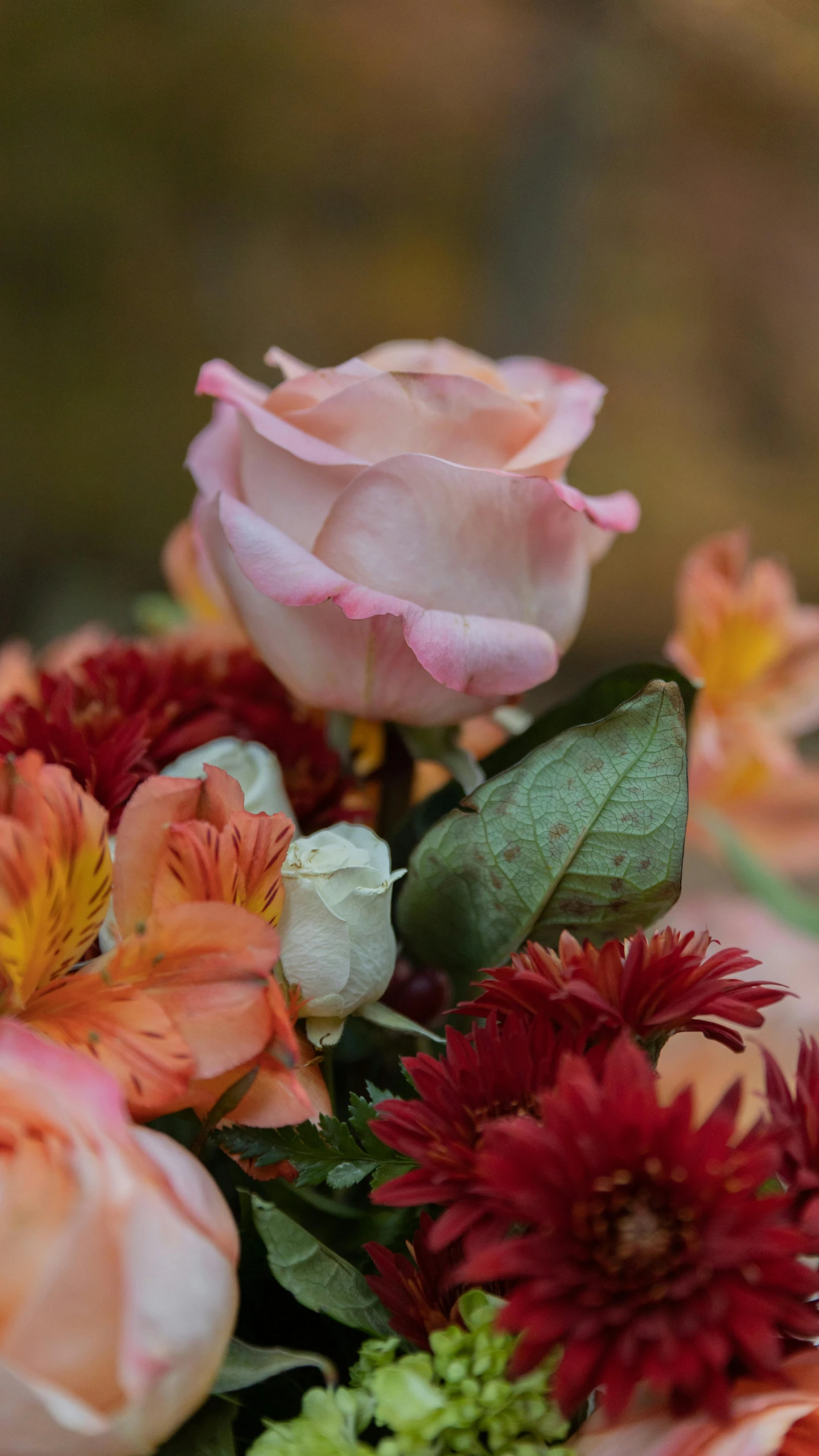 a bouquet of flowers sitting on top of a table