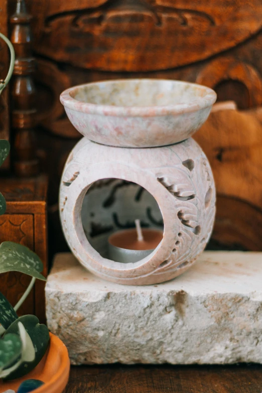 the small vase is made out of two clay bowls