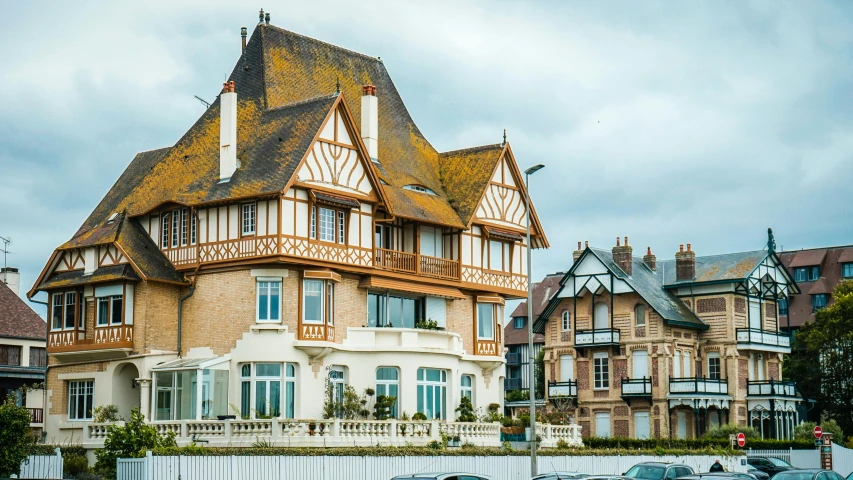 an old victorian house on the corner of a road