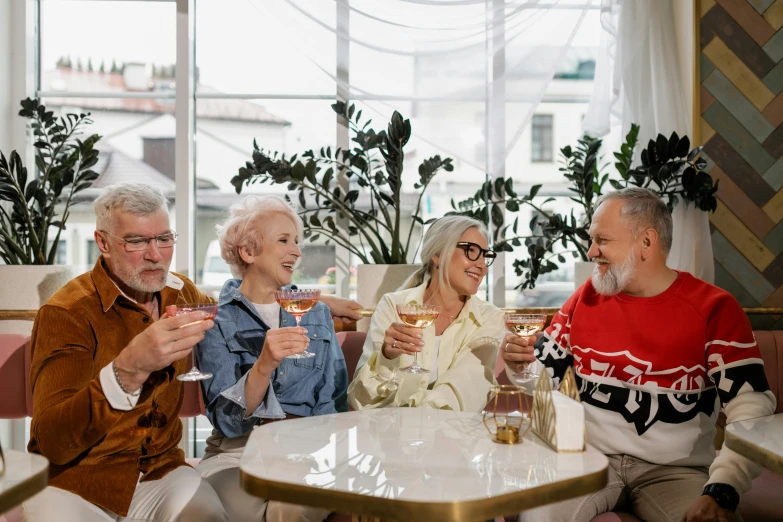 a group of people having drinks in a restaurant