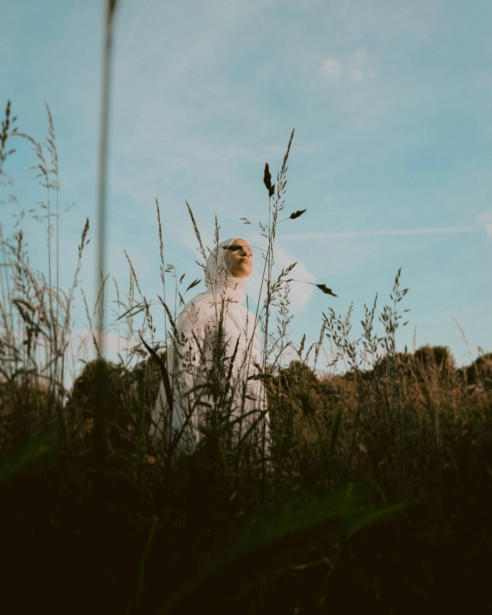 an image of man standing alone in the grass