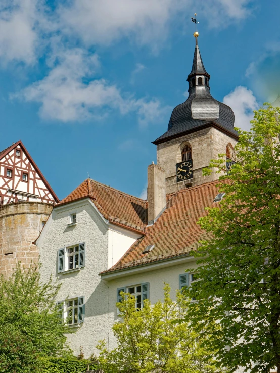 a beautiful building with two towers and a cross on it