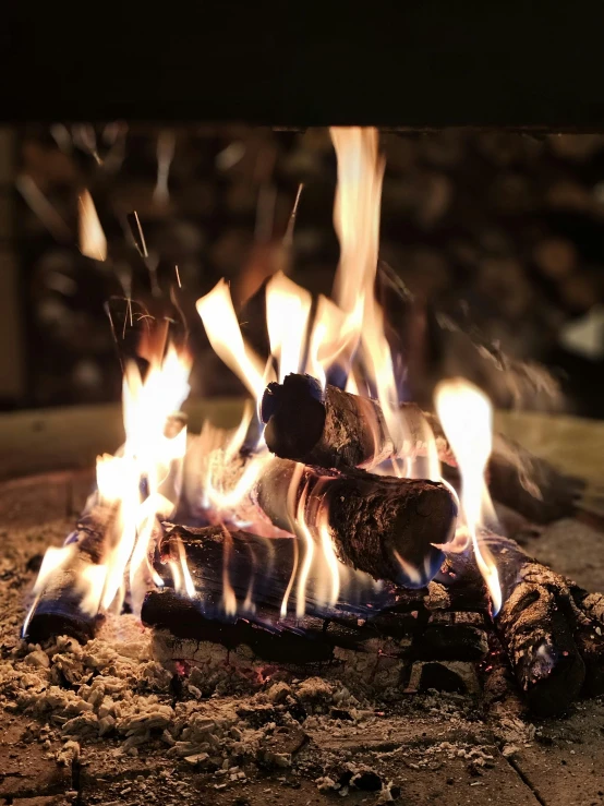 fire blazing on the ground in a fireplace