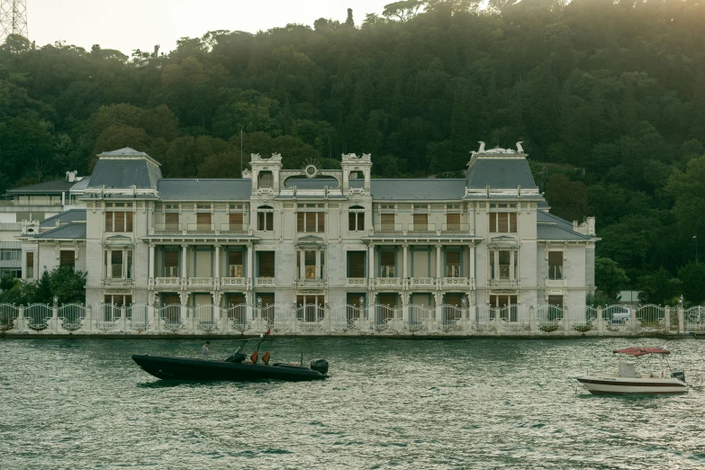 a view of a boat near a large white building