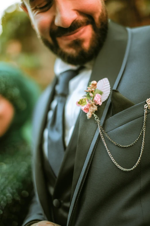 a person in a suit and tie with some flowers on it