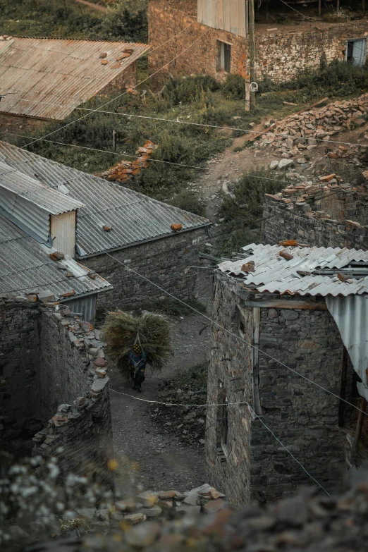 a group of buildings on the side of the hill