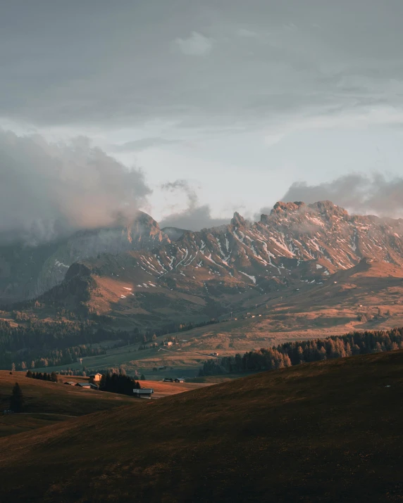 the clouds are gathering in the mountain landscape