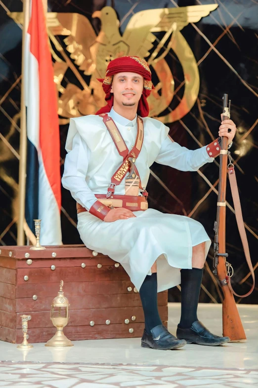 an elaborately dressed person sitting in a trunk