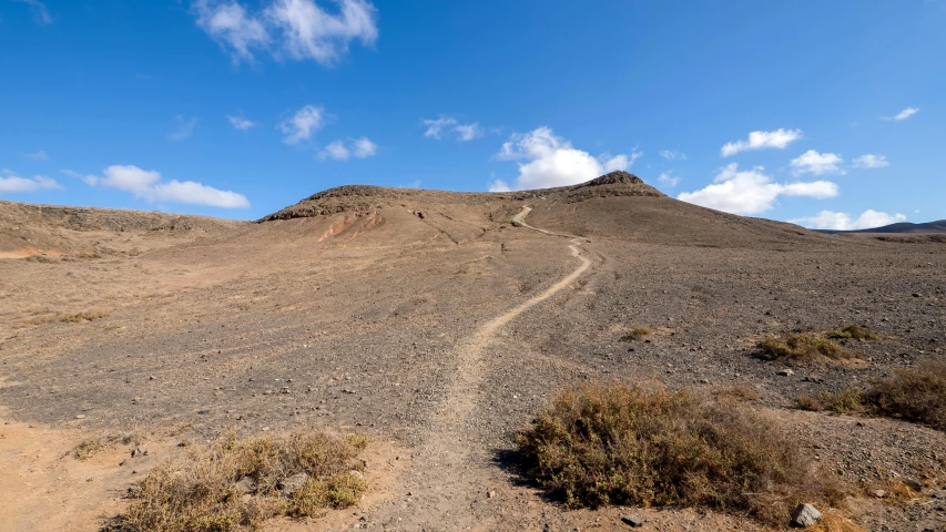 a hill of rocks on the side of a hillside