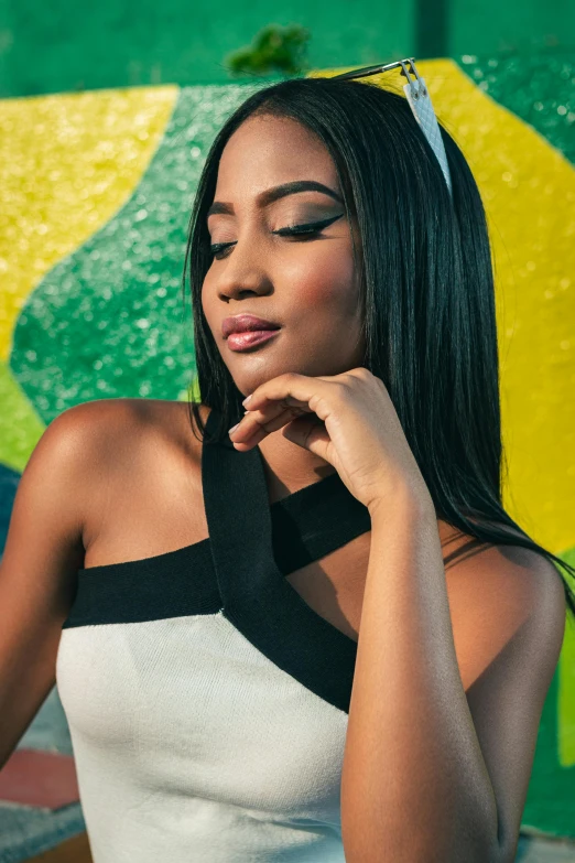 a woman is posing with long black hair