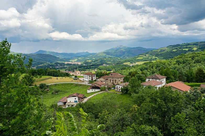 a large building with a lush green forest below