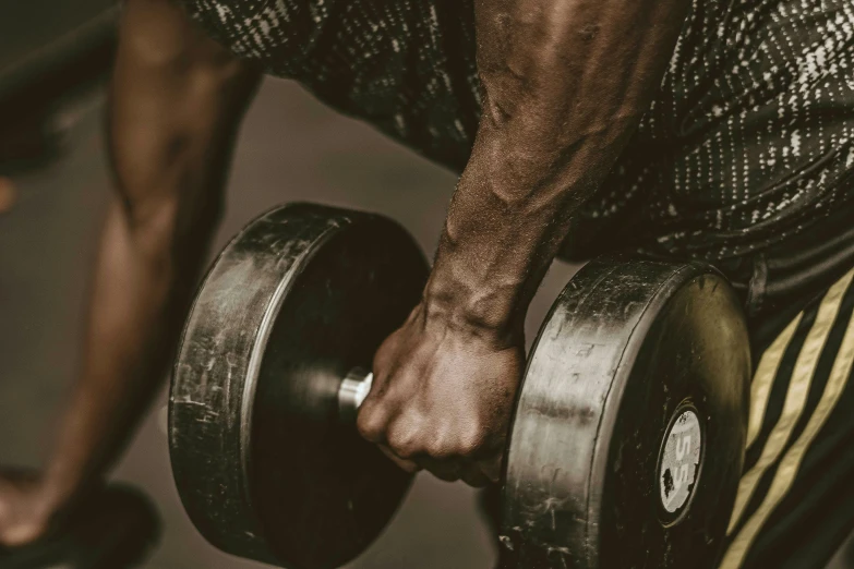 the man is training with the barbell