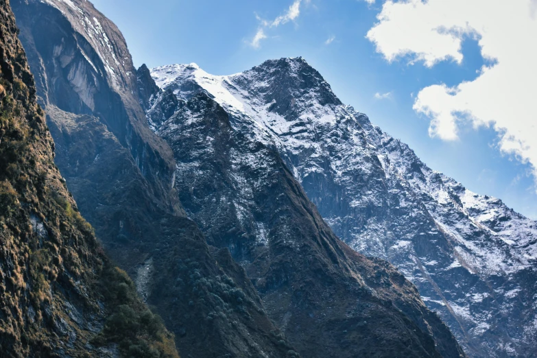 snow covered mountains sitting below a very blue sky