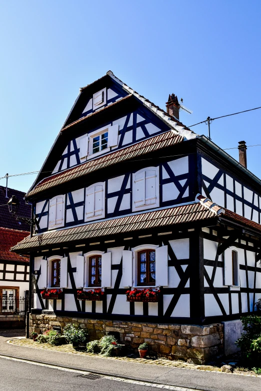 black and white house with a black roof