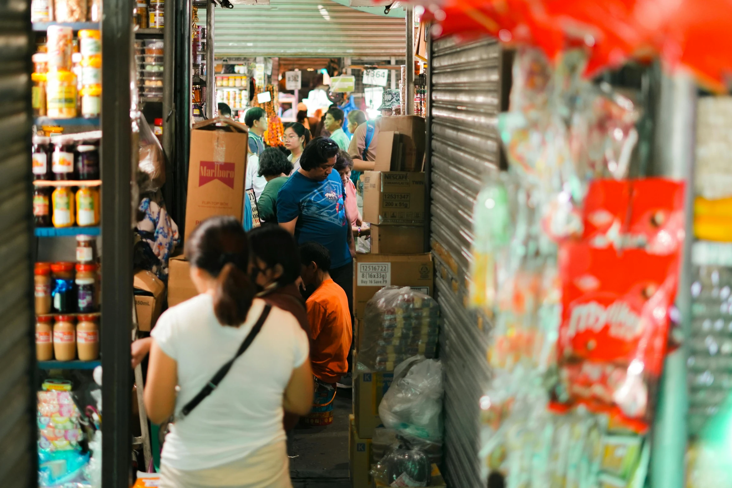 people are walking in and out of the food cart