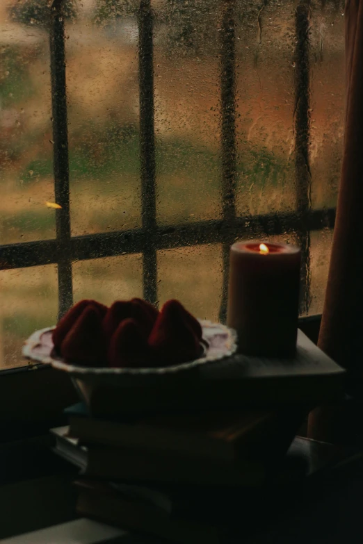 a plate full of food is sitting next to a window