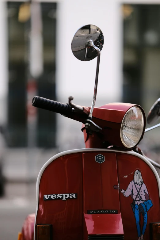 a scooter is parked on the side of the road