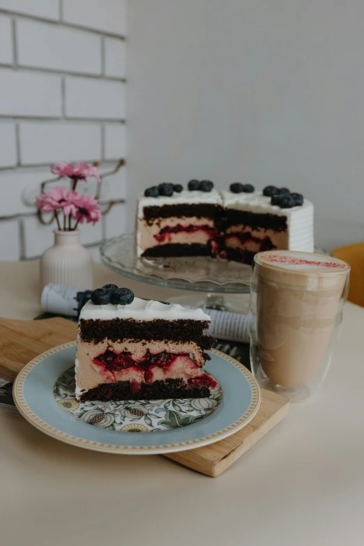 a slice of cake and cup of coffee on a tray