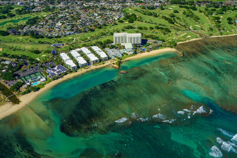 an aerial view of a resort in a tropical island