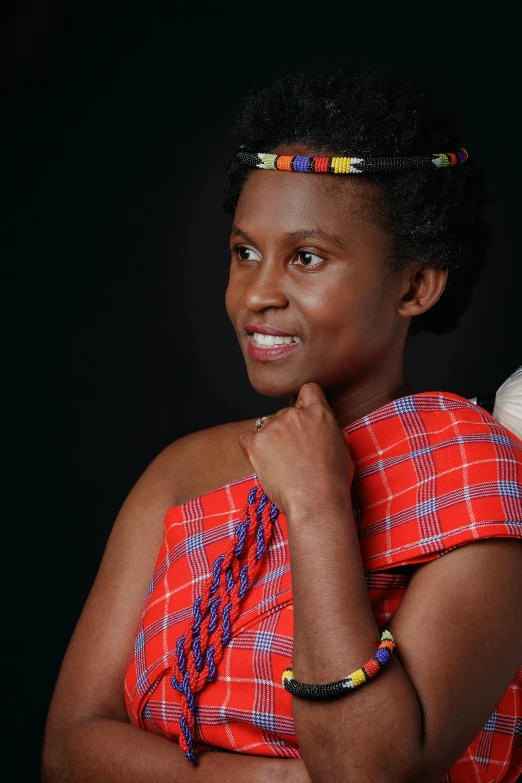 a woman is wearing a headband and smiling