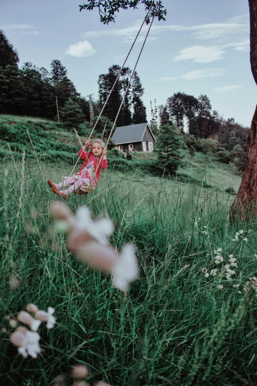 a person sitting in a chair in front of a tree