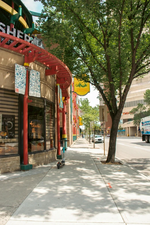 a small building with a store on the corner