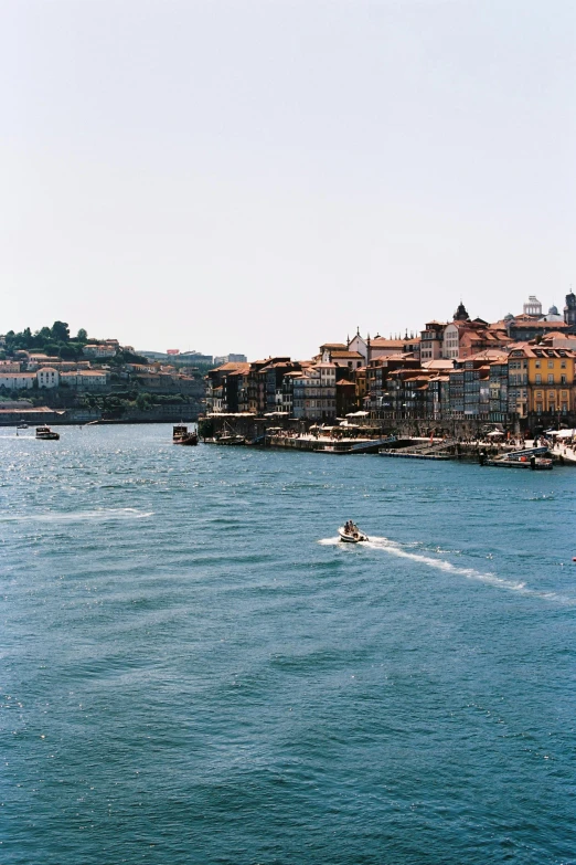 a water skiing boat is on the open water