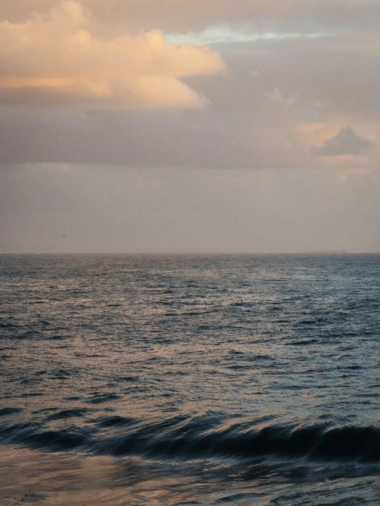 a lone surfer is riding a wave in the ocean