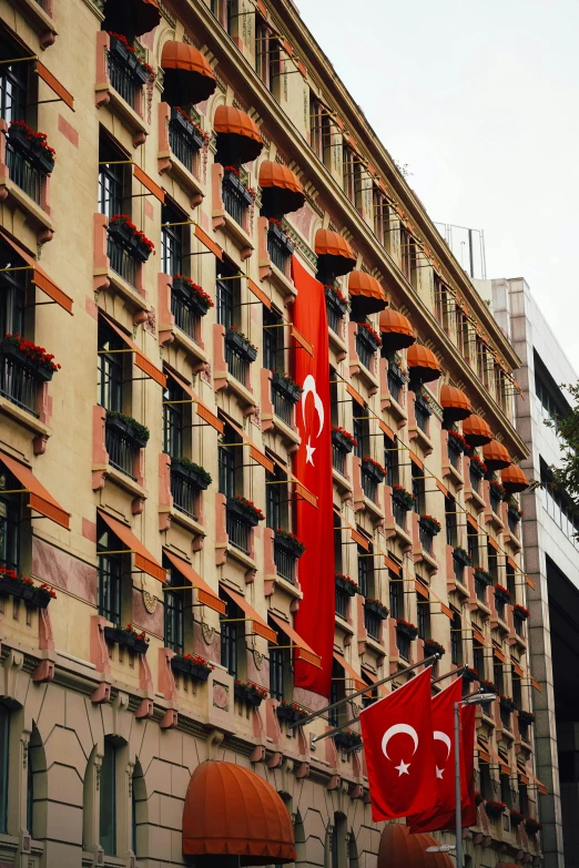 flags hang on the side of an el