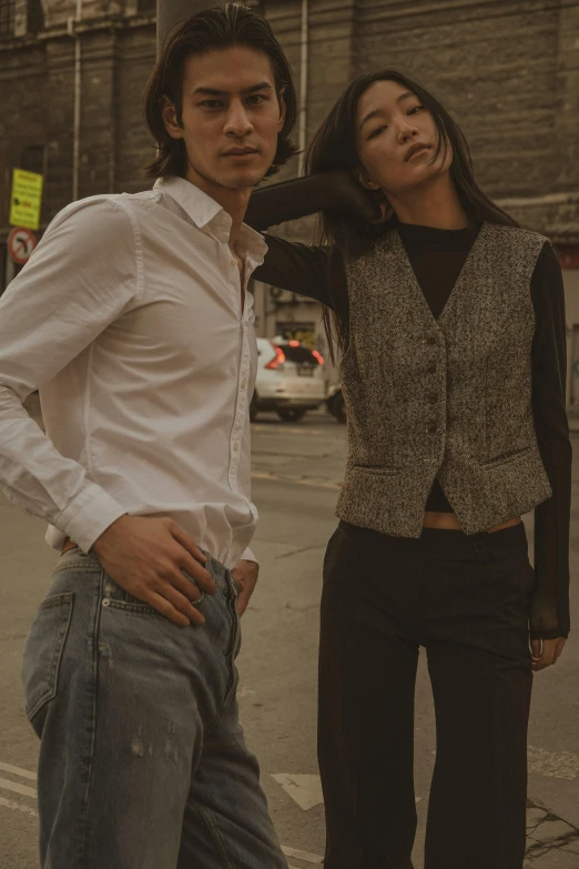 a man and a woman standing on the street